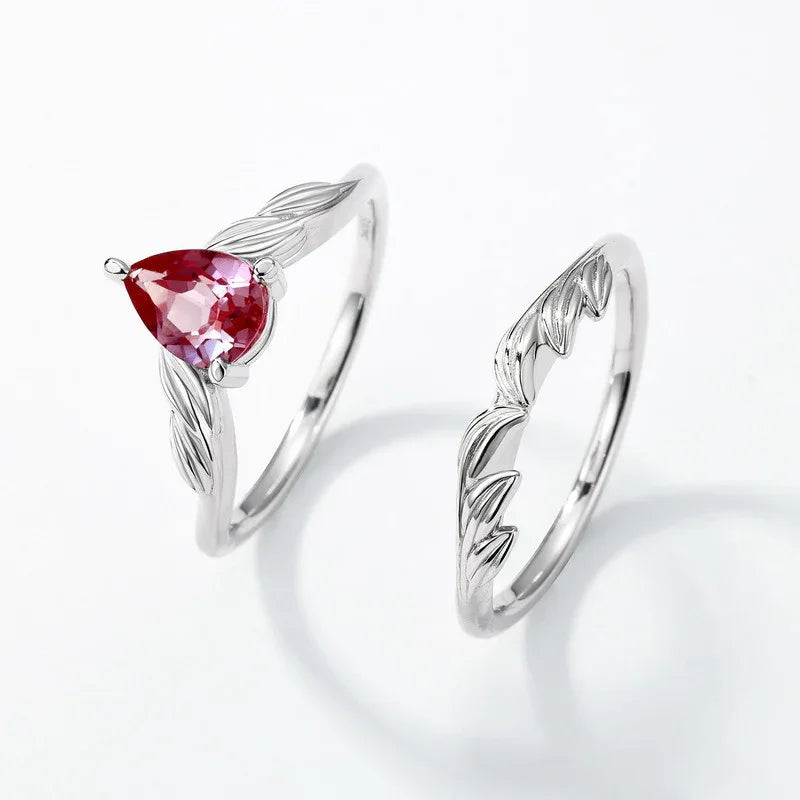 Pear-cut Alexandrite leaf stack ring, alternate separated ring set shown on a white background