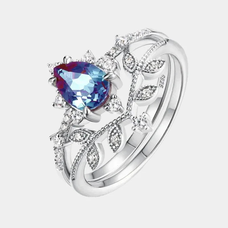 Pear-cut Alexandrite vine stack ring with leaf accents, front product view on a white background