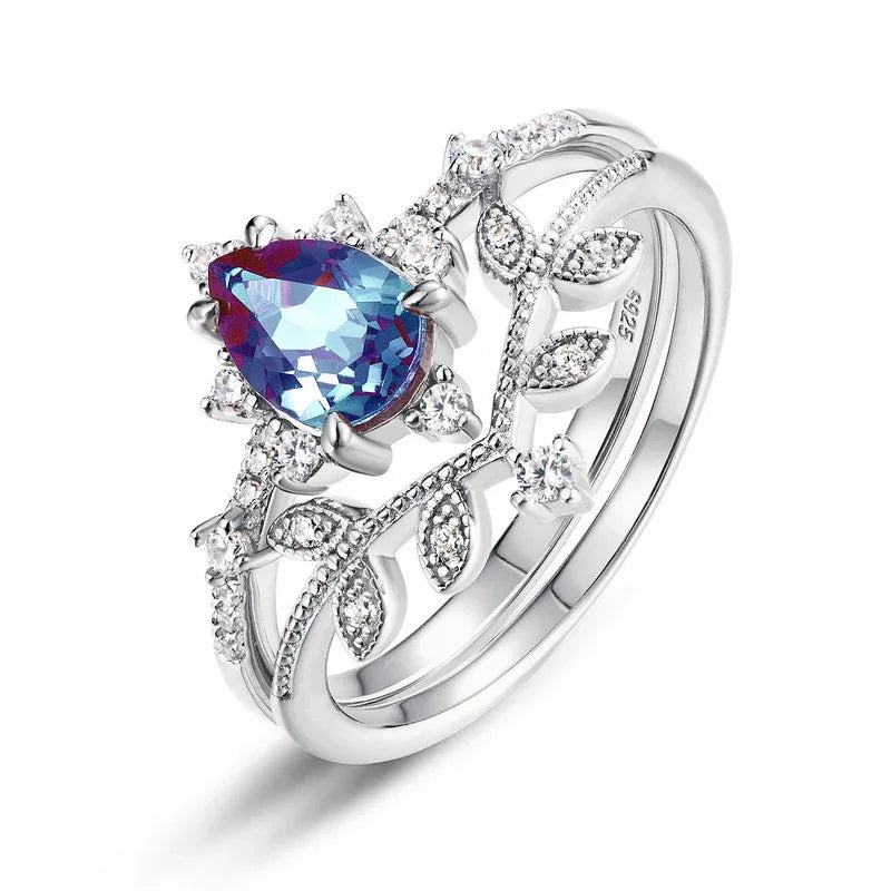 Pear-cut Alexandrite vine stack ring with leaf accents, alternate front product view on a white background