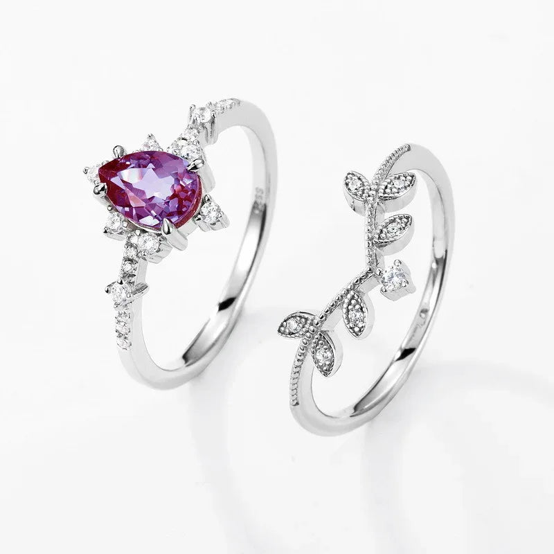 Pear-cut Alexandrite vine stack ring with leaf accents, alternate separated ring set shown on a white background