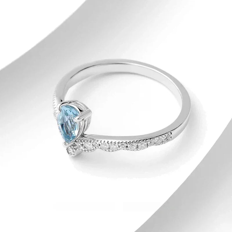 Pear-Cut Aquamarine Chevron Ring angled product view showing the setting