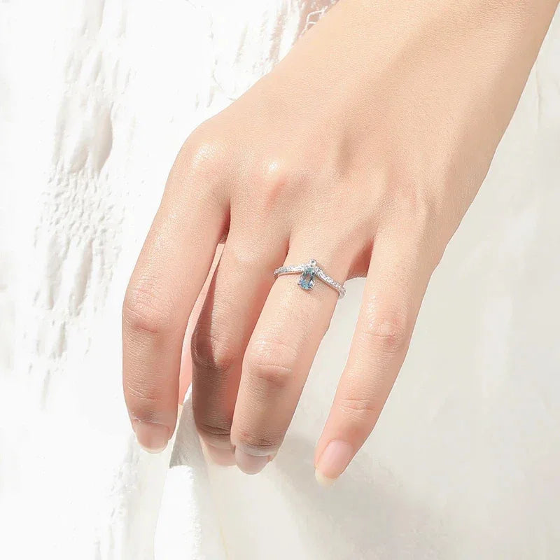 Pear-Cut Aquamarine Chevron Ring worn on the hand in a close-up