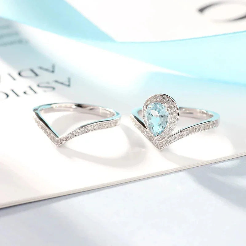 Pear-Cut Aquamarine Crown Stack Ring angled product view showing the setting