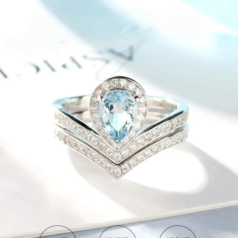 Pear-Cut Aquamarine Crown Stack Ring styled hand view showing ring scale