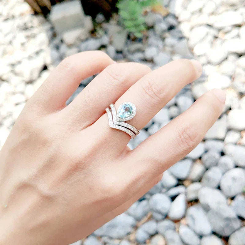 Pear-Cut Aquamarine Crown Stack Ring worn on the hand from a second angle