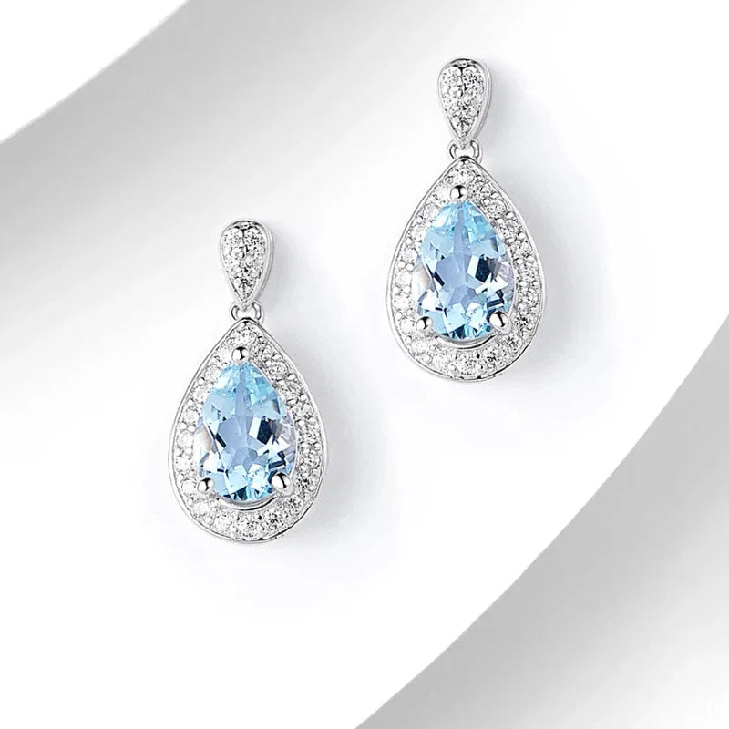 Pear-Cut Aquamarine Halo Drop Earrings angled pair on a white background