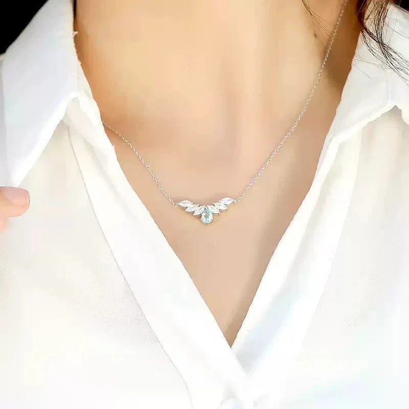 Pear-Cut Aquamarine Leaf Accent Necklace worn at the neckline in a close-up