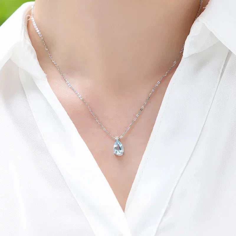 Pear-Cut Aquamarine Pendant Necklace worn at the neckline from a second angle