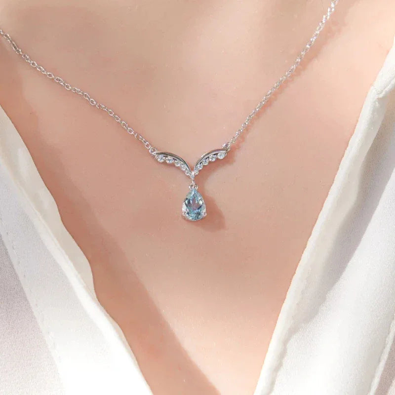 Pear-Cut Aquamarine Wing Pendant Necklace worn at the neckline from a second angle