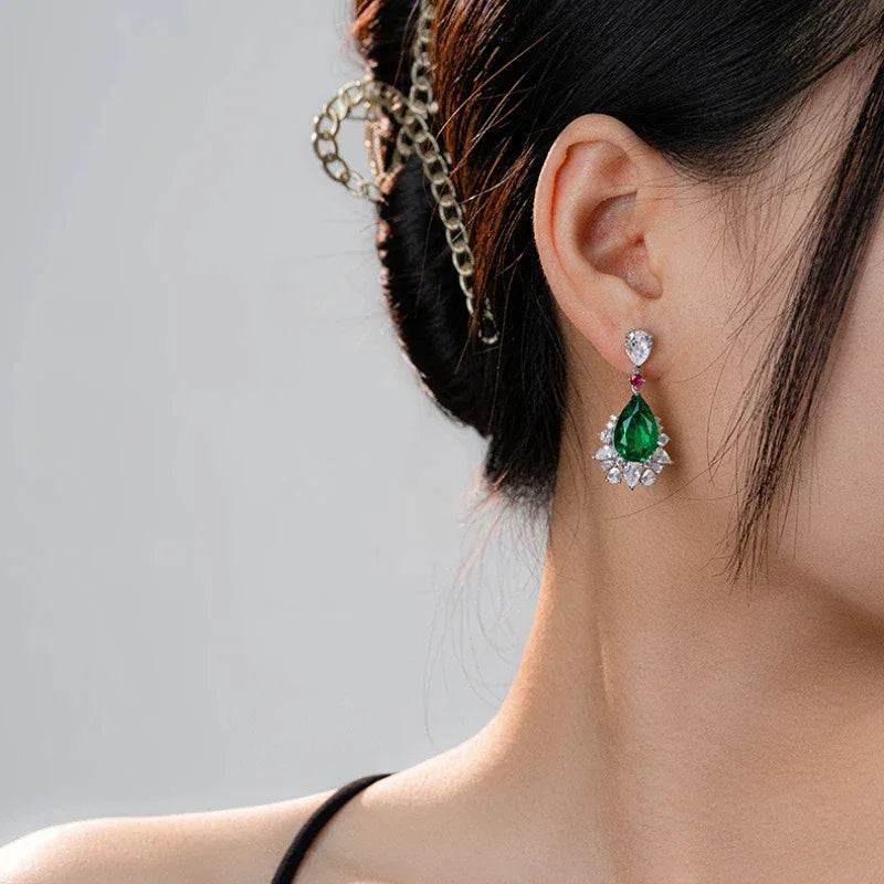 Pear-Cut Emerald and Pink Accent Drop Earrings styled ear view showing scale