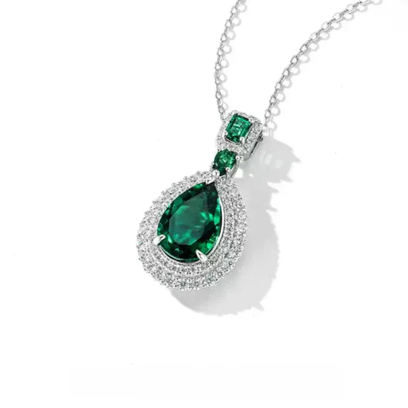Pear-Cut Emerald Double-Halo Pendant Necklace pendant and chain detail on white