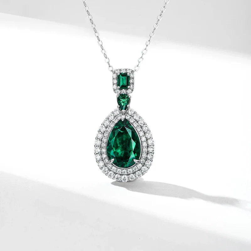 Pear-Cut Emerald Double-Halo Pendant Necklace pendant view on a dark background