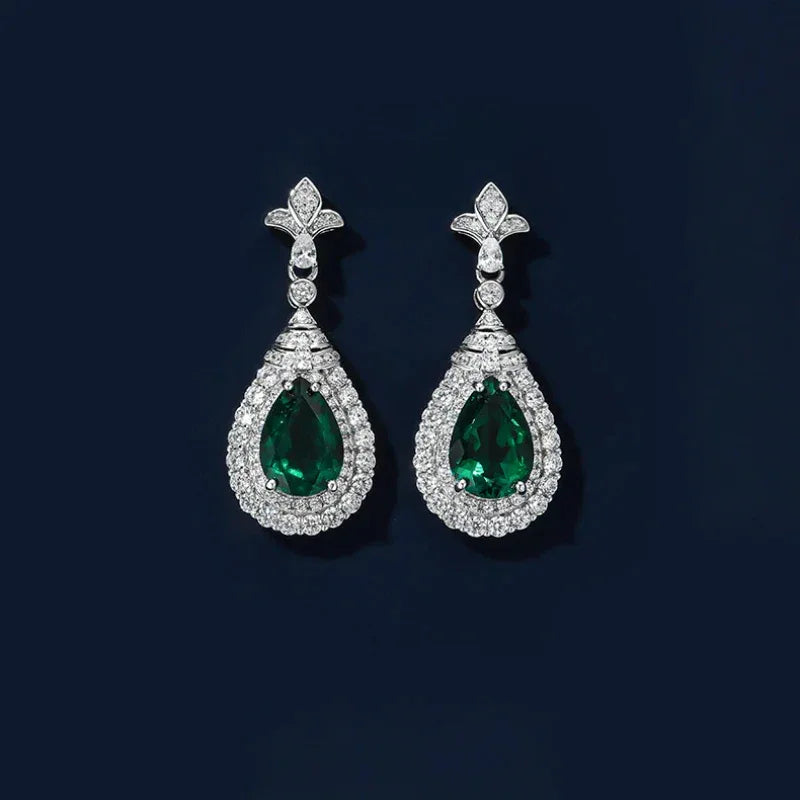 Pear-Cut Emerald Halo Drop Earrings paired product view on a dark background