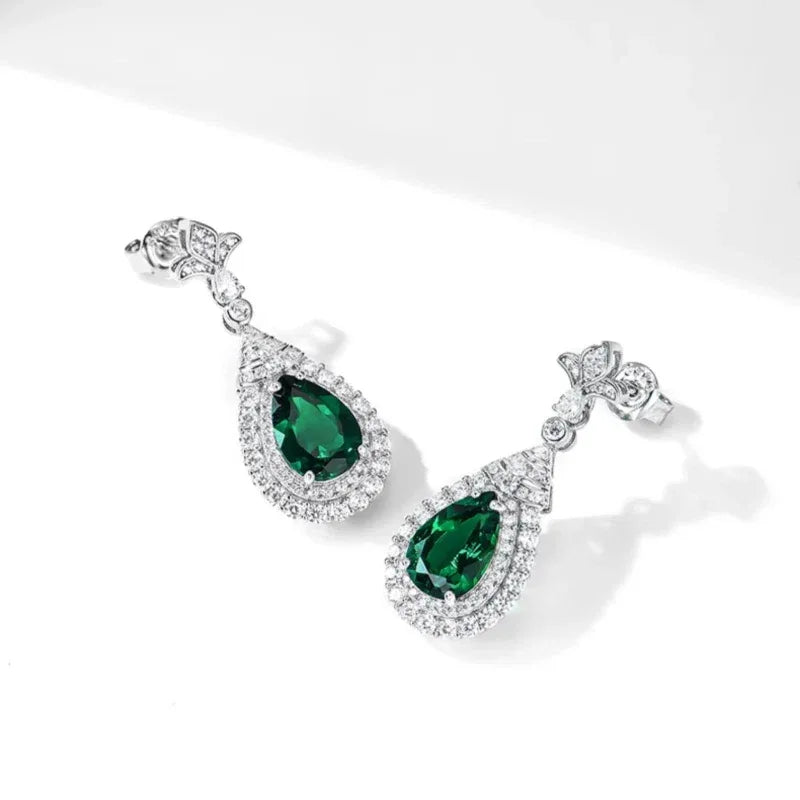 Pear-Cut Emerald Halo Drop Earrings side view showing posts and settings