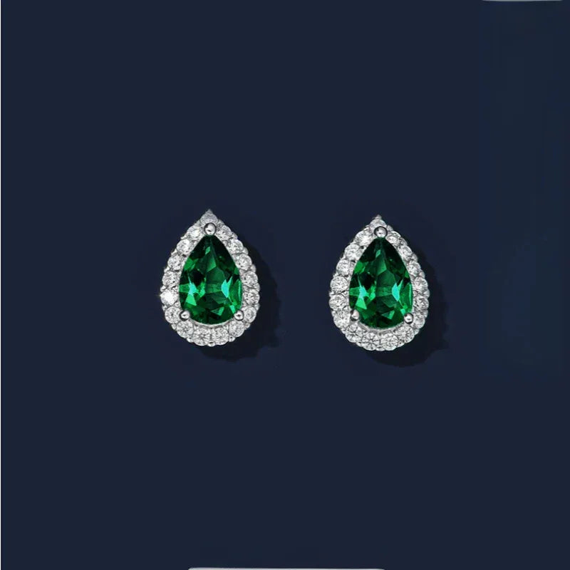 Pear-Cut Emerald Halo Stud Earrings paired product view on a dark background