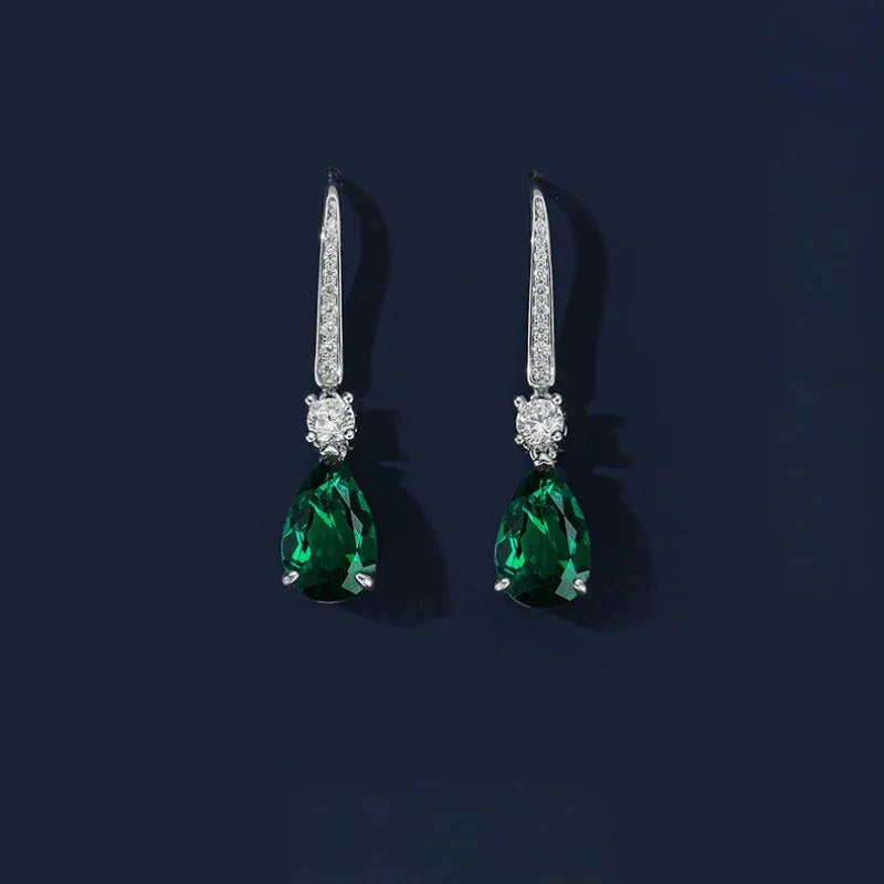 Pear-Cut Emerald Long Drop Earrings paired product view on a dark background