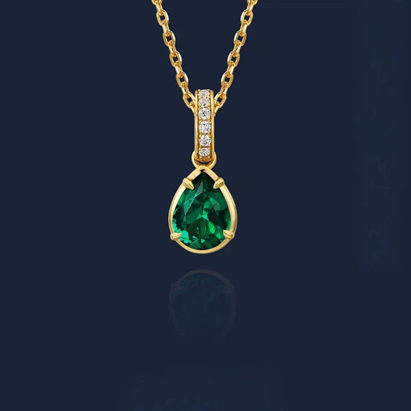 Pear-Cut Emerald Pendant Necklace pendant view on a dark background