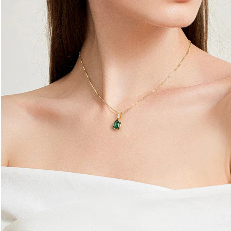 Pear-Cut Emerald Pendant Necklace worn at the neckline from a second angle