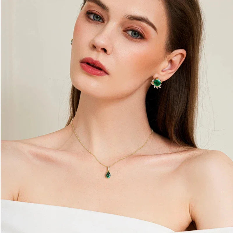 Pear-Cut Emerald Pendant Necklace worn at the neckline in a close-up