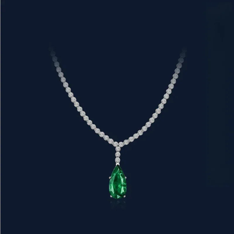 Pear-Cut Emerald Tennis Necklace pendant and chain detail on white