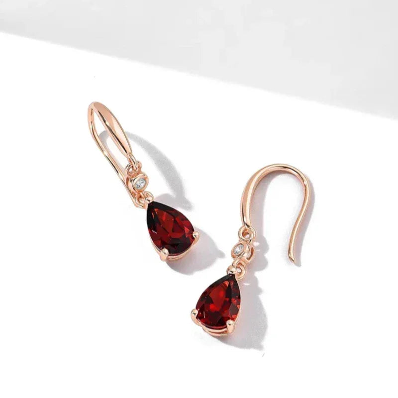 Pear-Cut Garnet Hook Drop Earrings angled product detail on a jewelry display