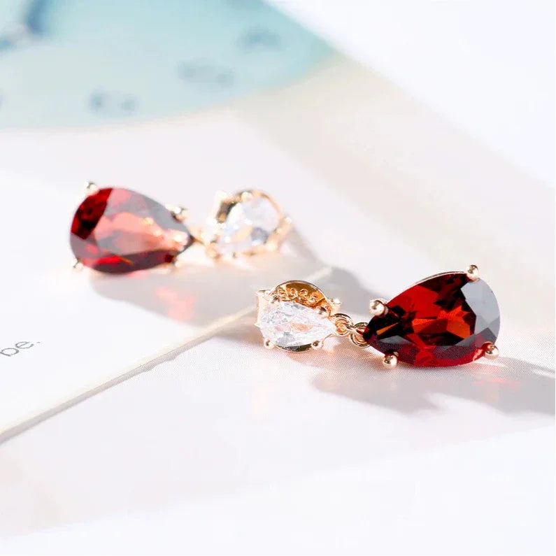 Pear-Cut Garnet Pavé Drop Earrings angled product detail on a jewelry display