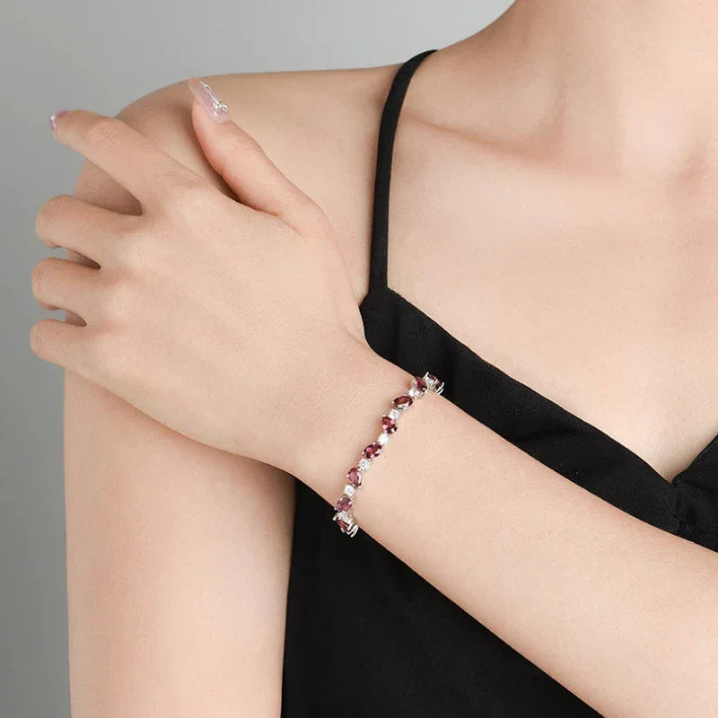 Pear-Cut Garnet Tennis Bracelet worn on the wrist from a second angle