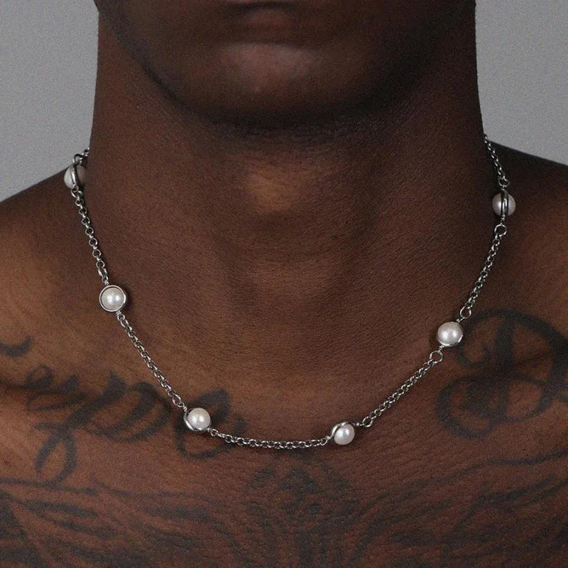 Station Pearl Chain Necklace — front chest-worn close-up over tattooed skin
