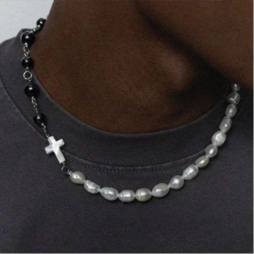 Pearl and Black Tiger Eye Cross Necklace — front neckline-worn view layered above a second pearl strand
