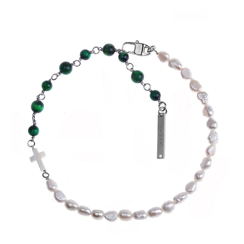 Pearl and Green Tiger Eye Cross Necklace — macro view of the white cross and adjacent connectors