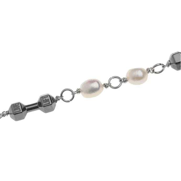 Pearl and Obsidian Beaded Necklace — macro view of pale pearls alternating with black and smoky-gray beads