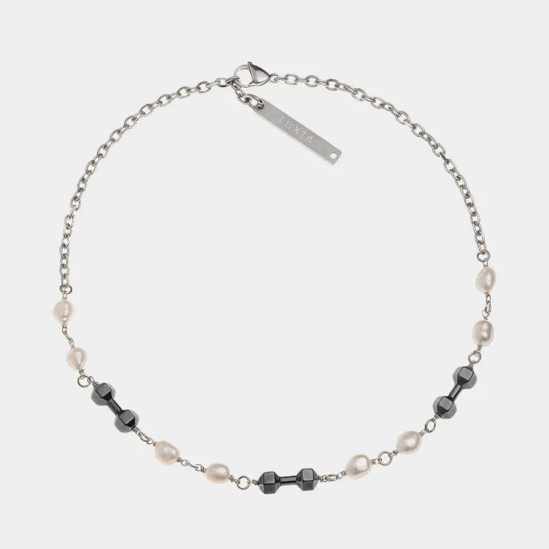 Pearl and Obsidian Beaded Necklace — front view of single-strand pearl and dark-bead necklace