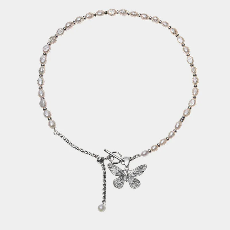 Pearl and Tiger Eye Butterfly Necklace — front view of pale beaded necklace with butterfly and hanging chain