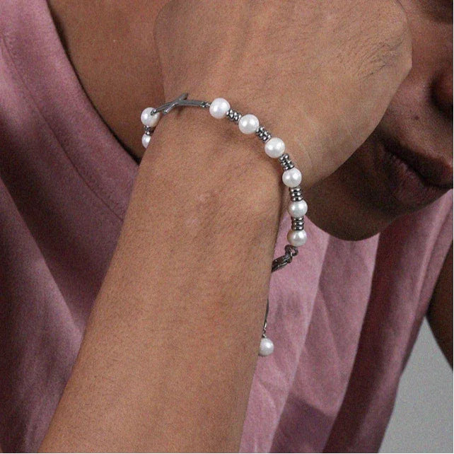 Adjustable Pearl and Titanium Steel Cross Bracelet — alternate wrist-worn view showing the extension chain