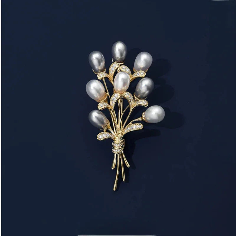 Two-Tone Pearl Bouquet Brooch — front product view on a dark background