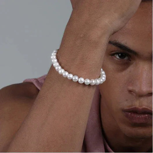 Adjustable Pearl Strand Bracelet — wrist-worn portrait beside the model's face