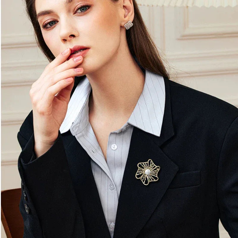 Pearl Openwork Camellia Brooch — model portrait with the brooch at the lapel