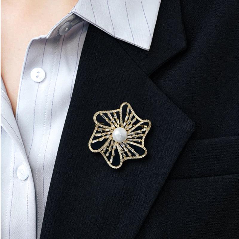 Pearl Openwork Camellia Brooch — close blazer-worn view showing scale