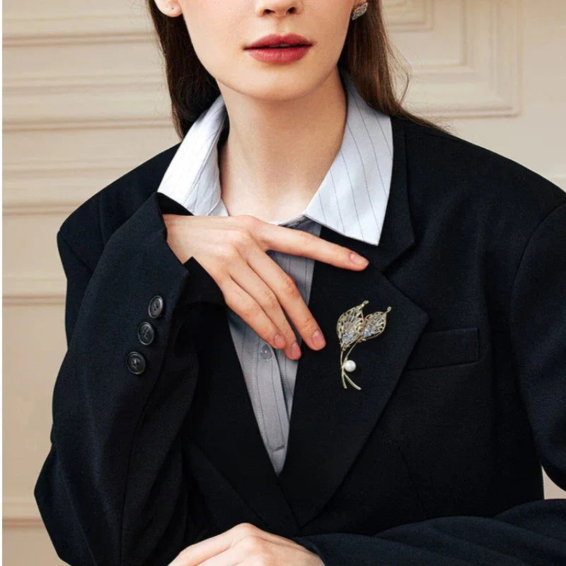 Pearl Calla Lily Brooch — waist-up model portrait showing scale