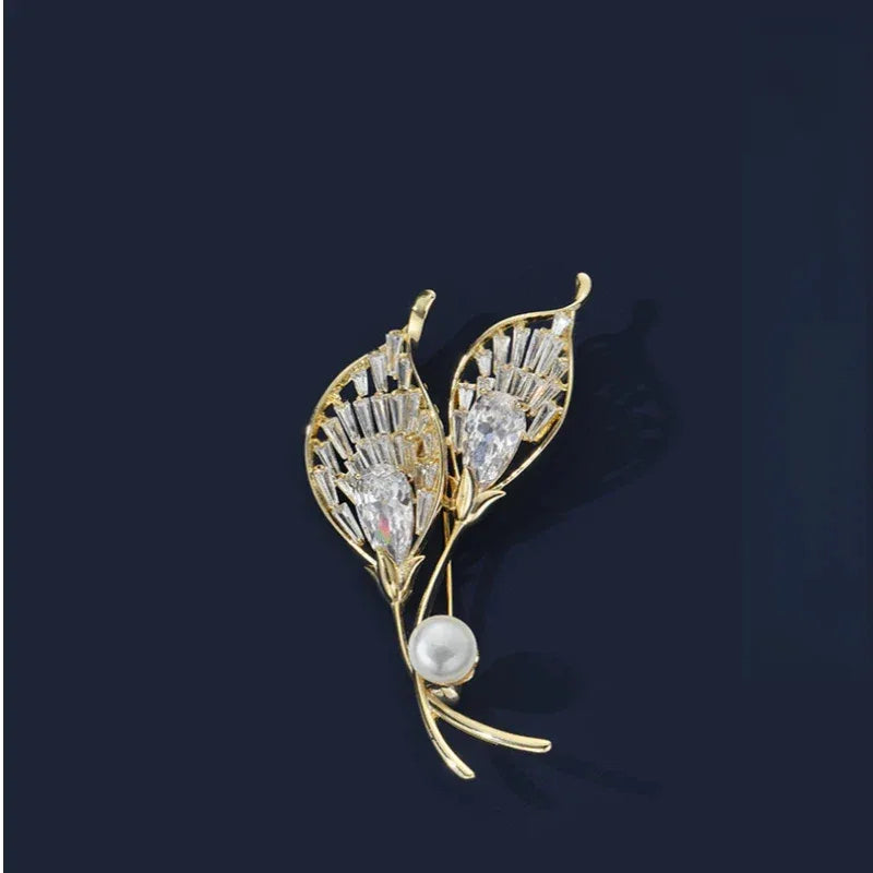 Pearl Calla Lily Brooch — front product view on a dark background