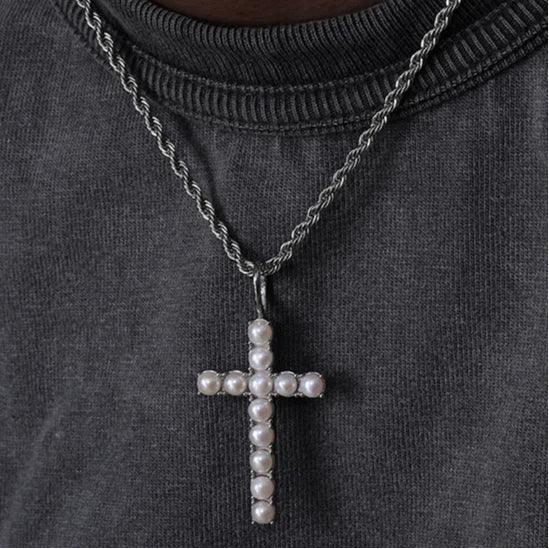 Pearl Cross Pendant Necklace — front neckline-worn view over a dark sweatshirt