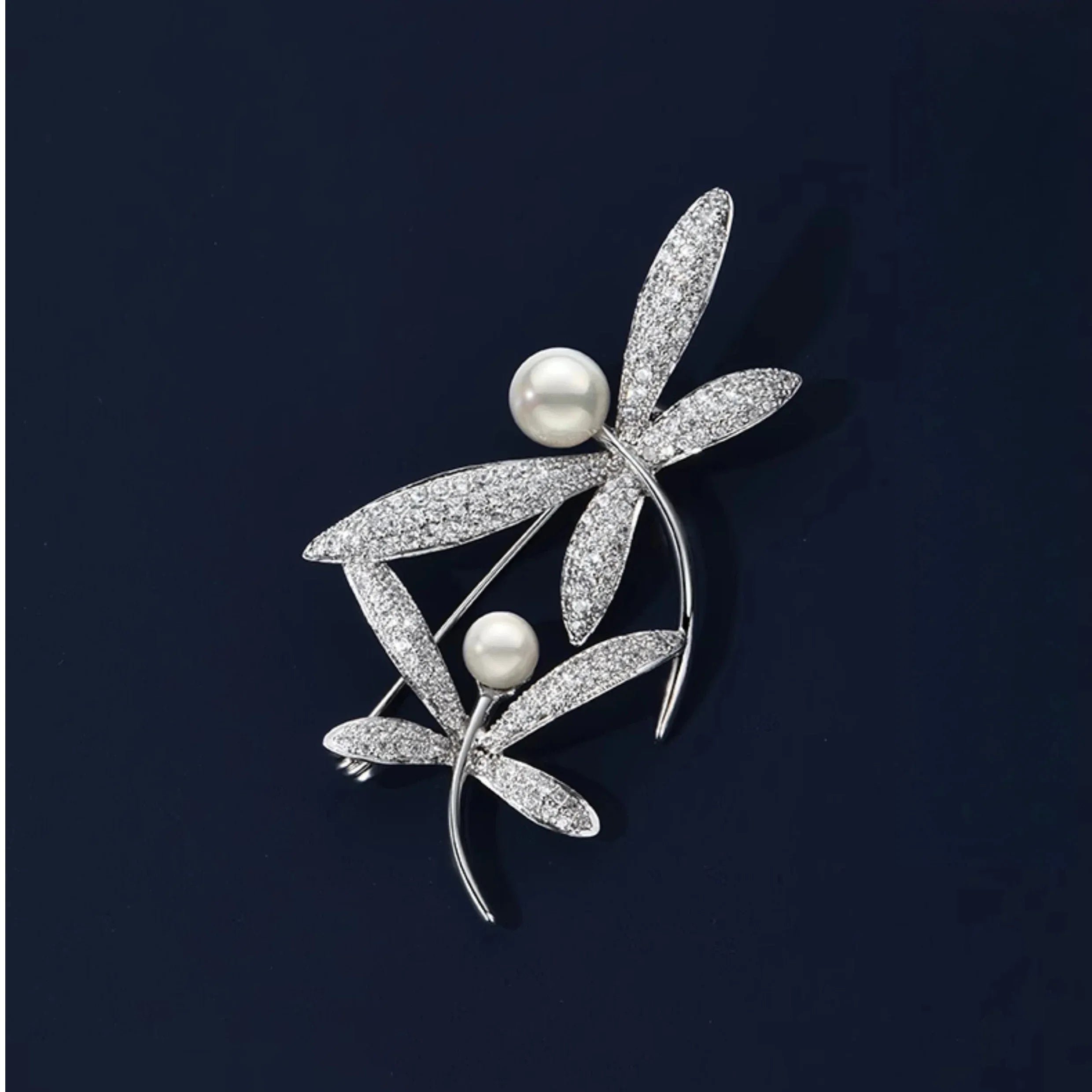 Pearl and Cubic Zirconia Dragonfly Brooch — front product view on a dark background