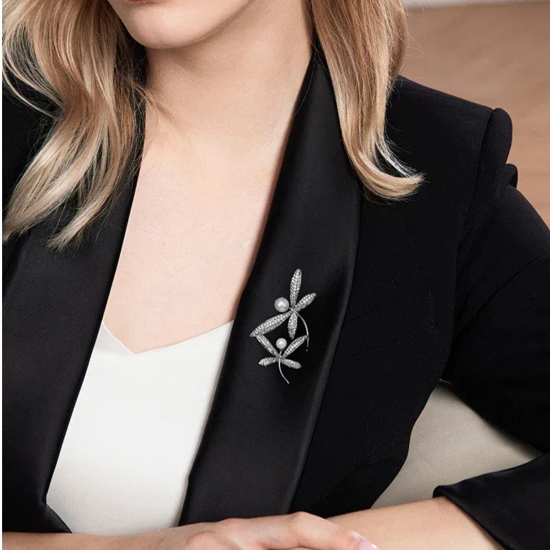 Pearl and Cubic Zirconia Dragonfly Brooch — waist-up blazer-worn view showing scale