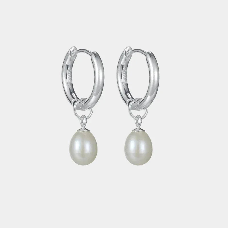 S925 Silver Pearl Drop Huggie Earrings — front pair of polished huggie hoops with oval pearl drops