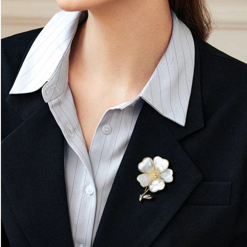 Mother-of-Pearl Five-Petal Flower Brooch — close blazer-worn view showing scale