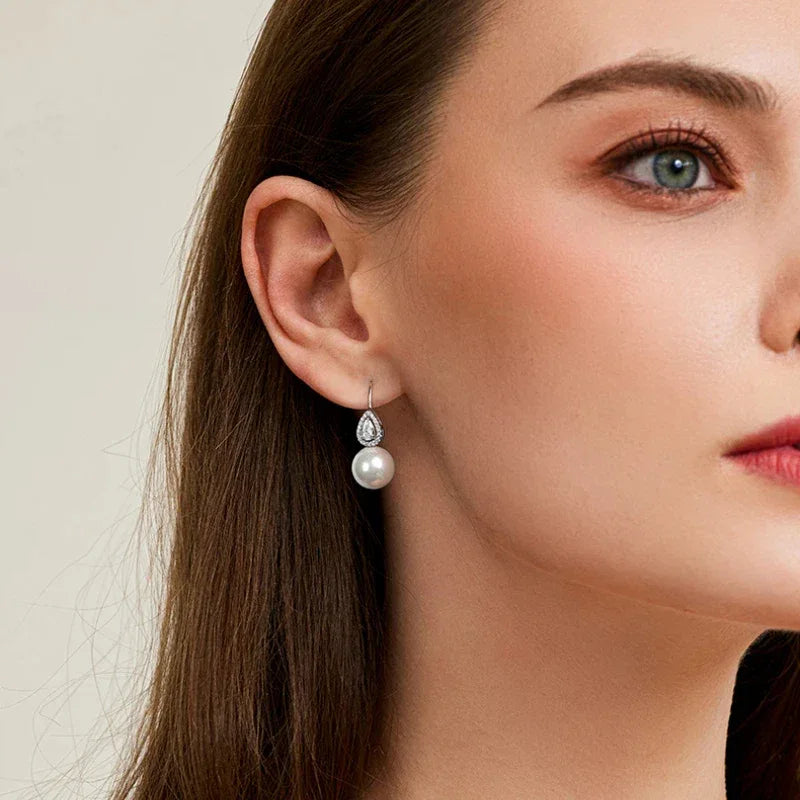 Pearl Teardrop Halo Earrings — alternate right-ear worn view showing scale
