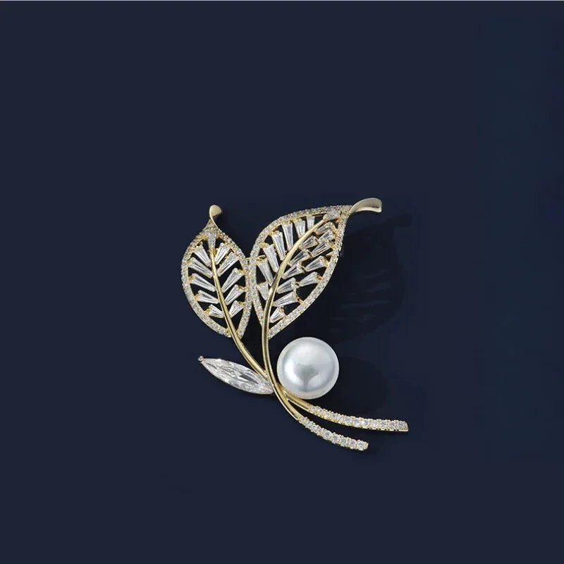 Pearl Double-Leaf Brooch — front product view on a dark background