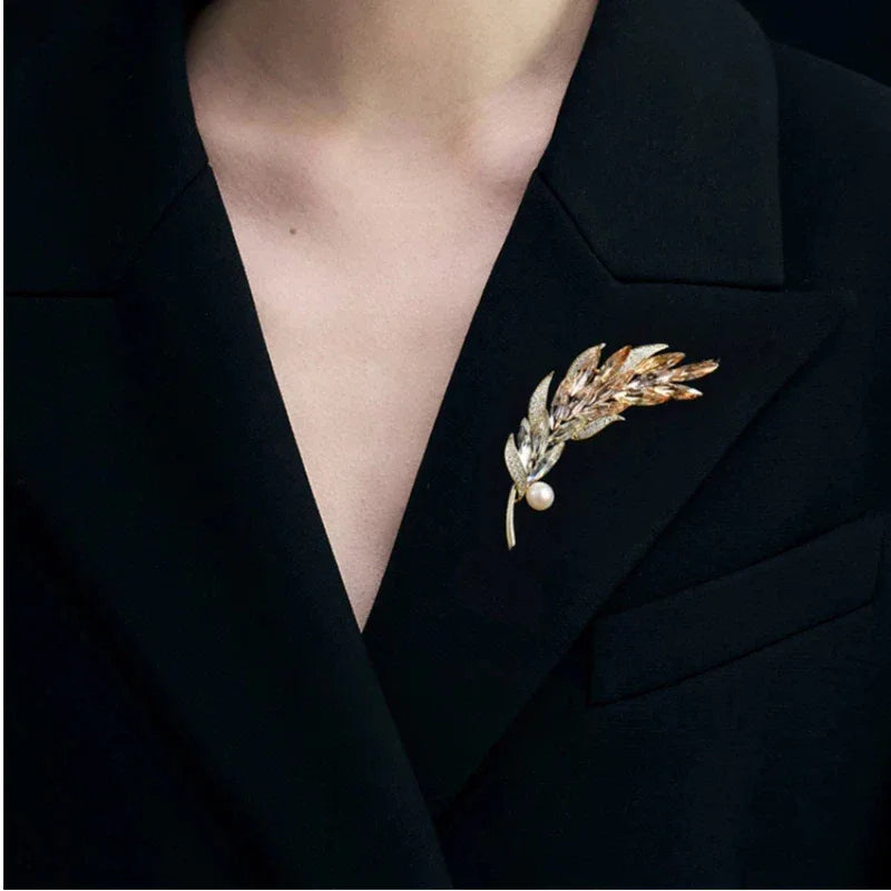 Pearl Gradient Wheat Sprig Brooch — close brooch view on a black blazer