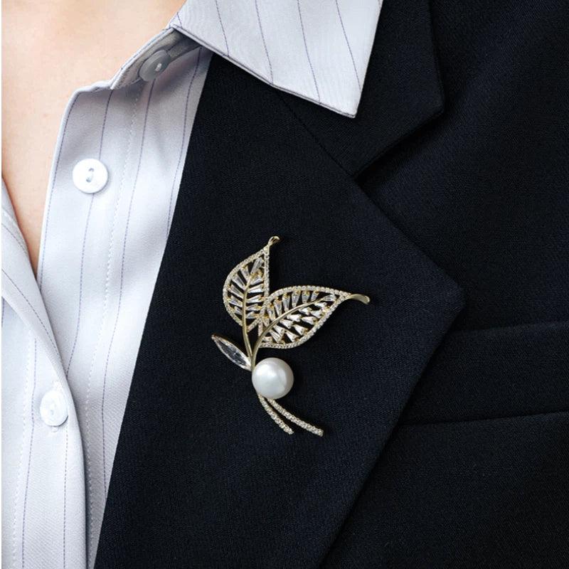 Pearl Double-Leaf Brooch — close blazer-worn view showing the brooch vertically