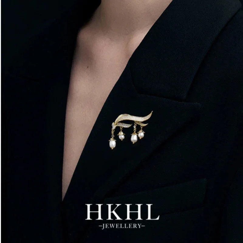 Pearl Lily of the Valley Tassel Brooch — close brooch view on a black blazer